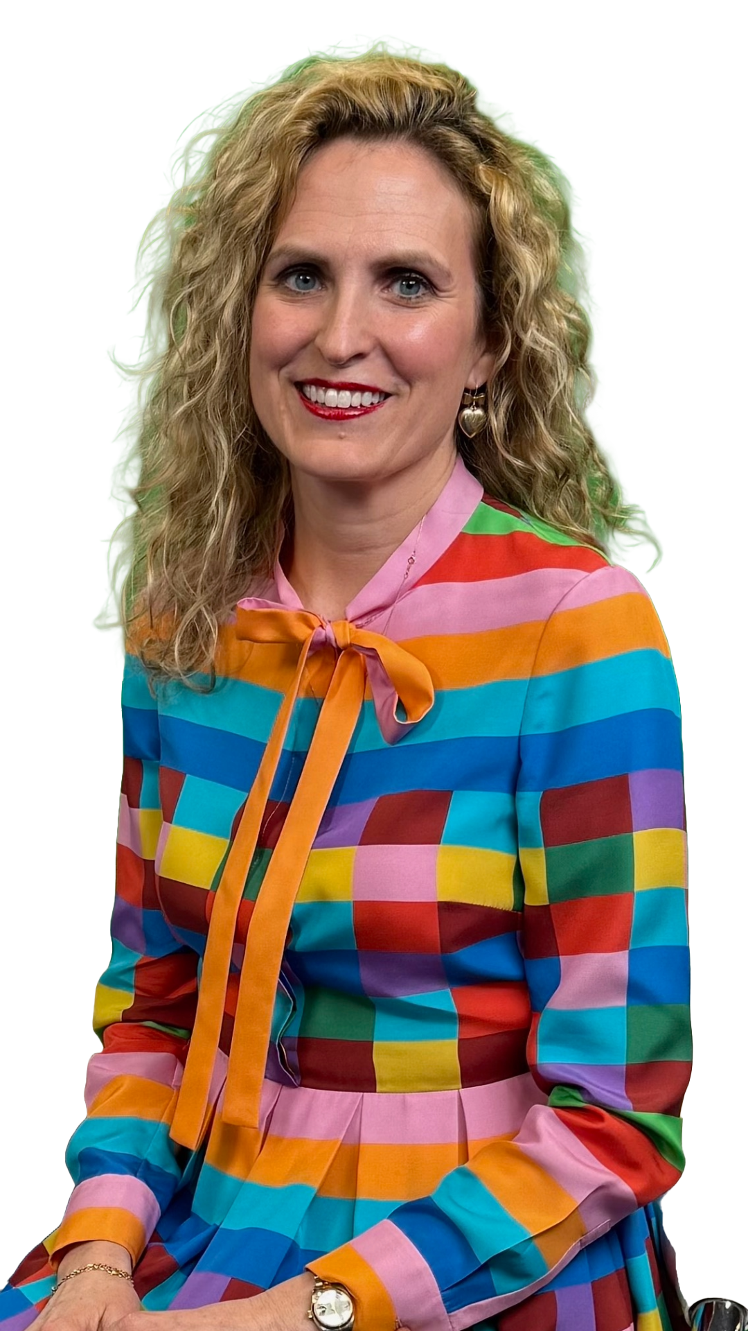 Portrait of Dr. Megan A. Ratliff smiling, with long, wavy blonde hair, wearing a strapless black dress with pink floral embroidery, symbolizing the friendly and professional image of the dental care provider.