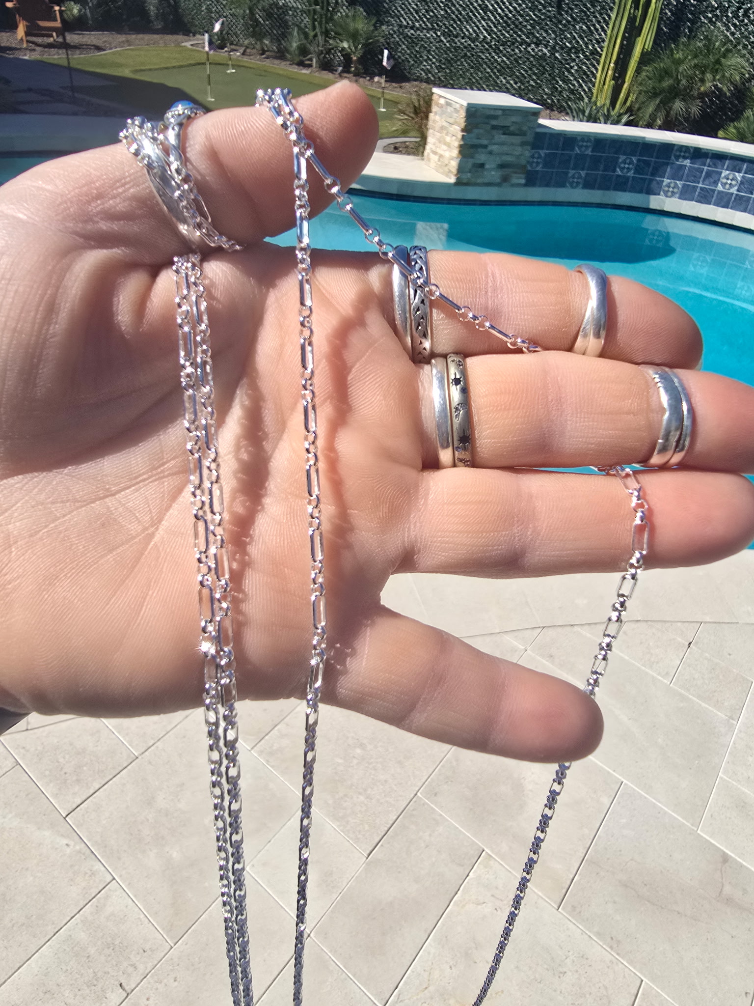 Gold elongated link and mixed chain styles on display Arizona