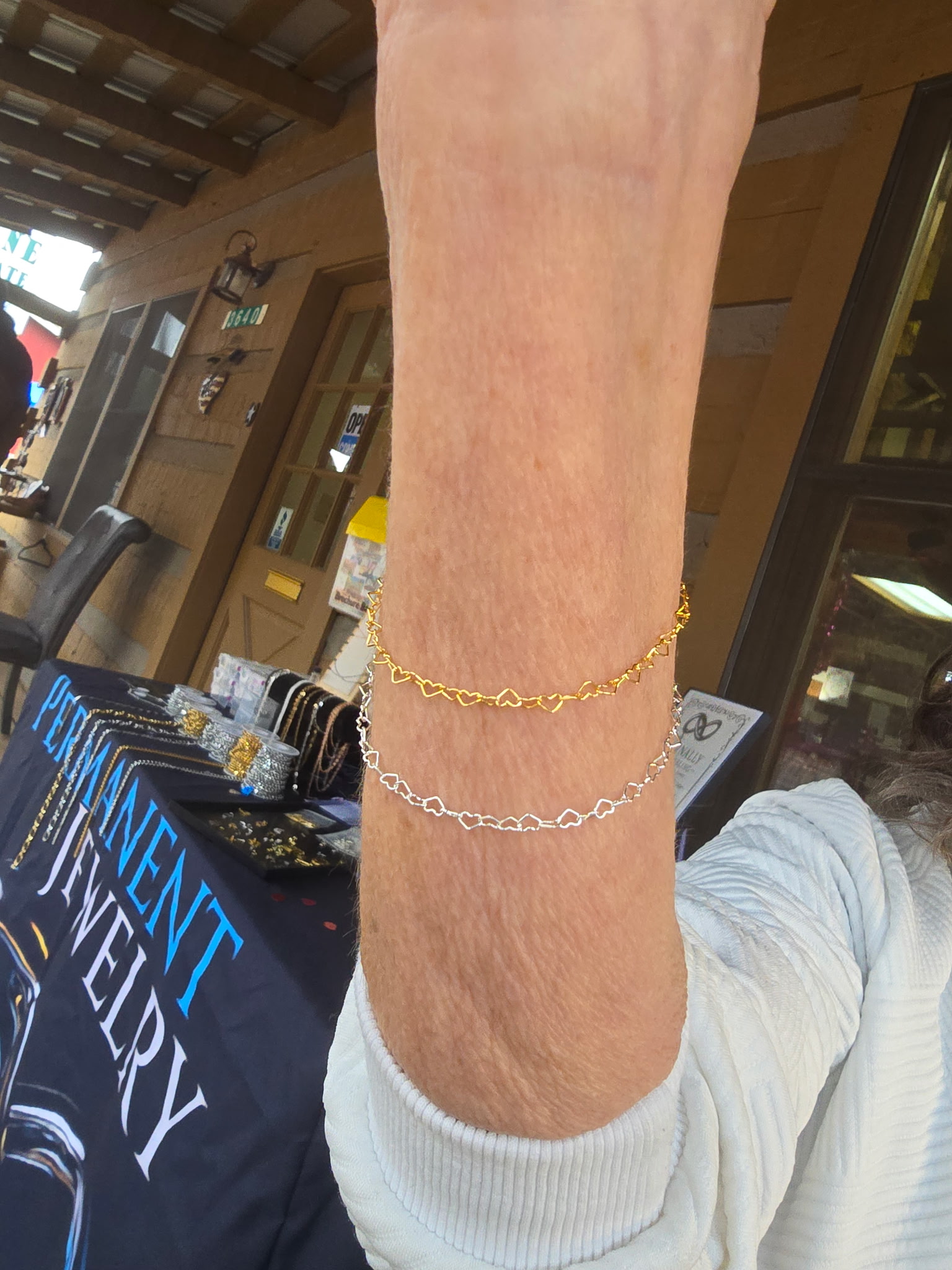 Gold and silver permanent bracelets welded at a Pine AZ vendor market booth