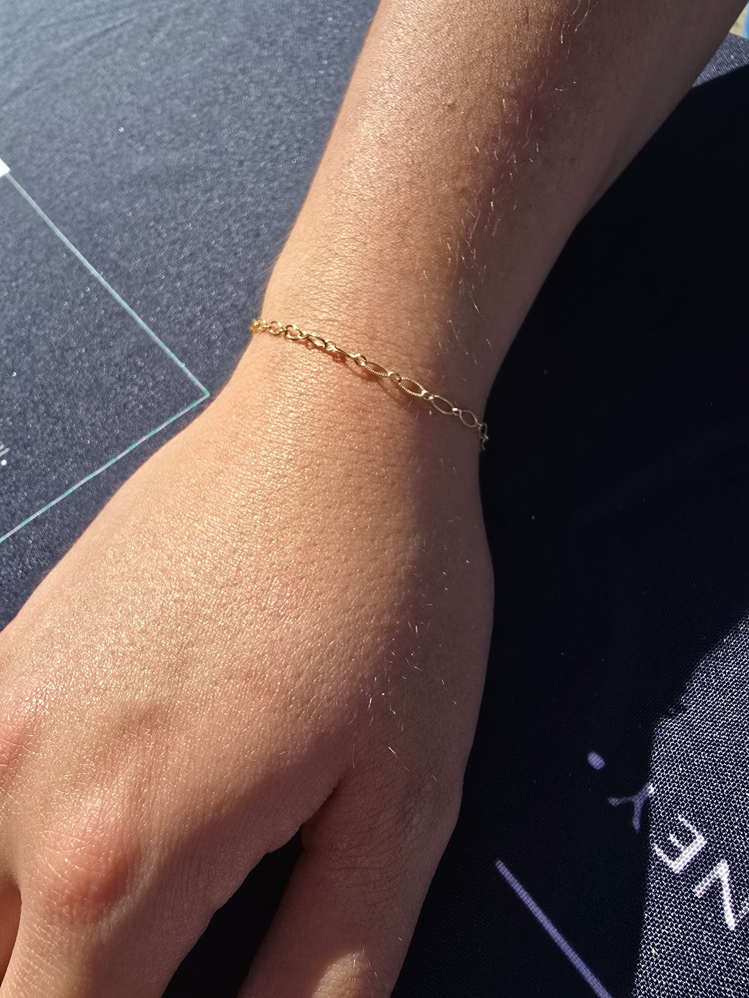 Gold paper-clip permanent bracelet on wrist Eternally Linked Bling Payson AZ
