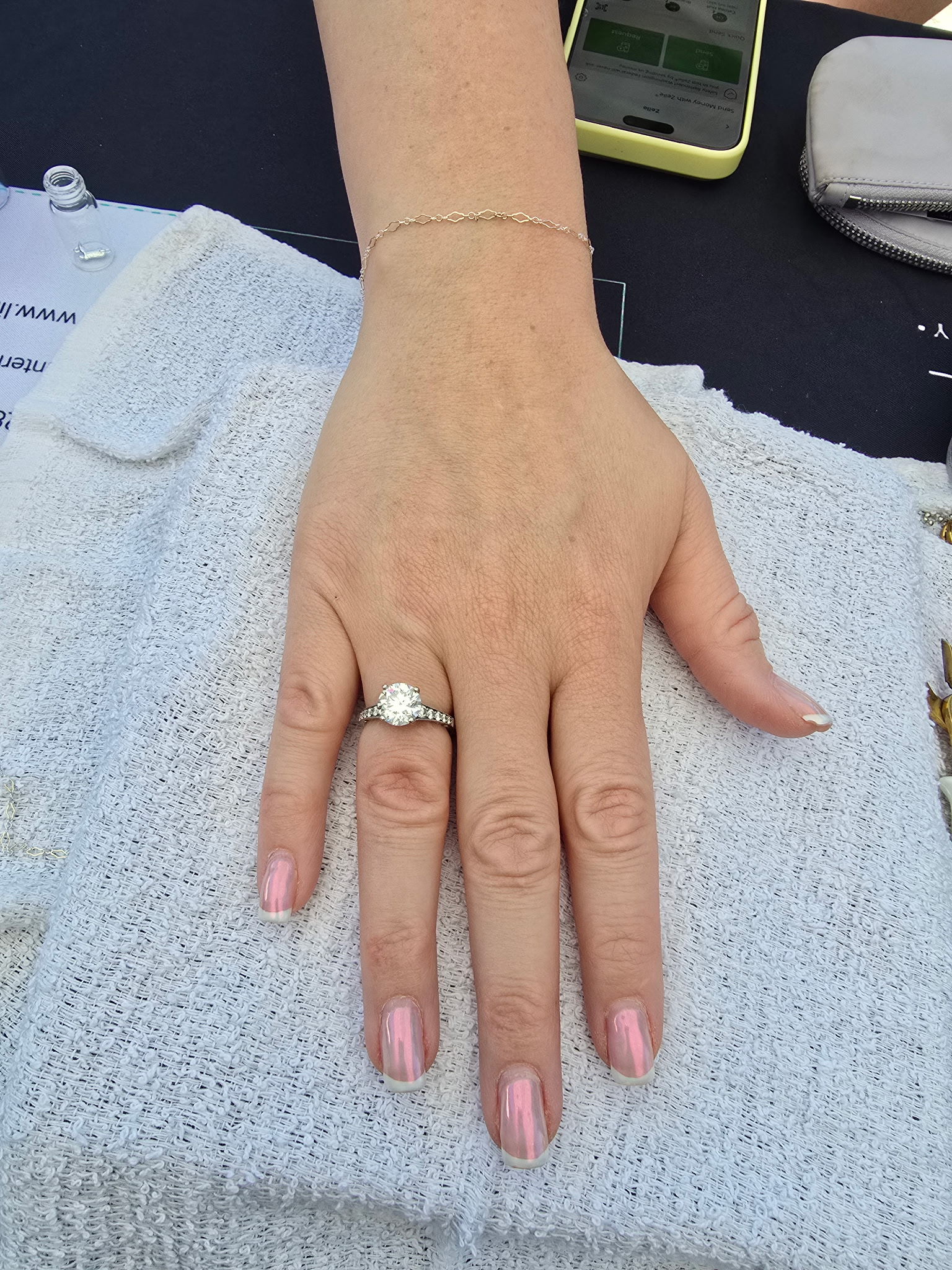 Permanent bracelet being fitted on a client's wrist at Eternally Linked Bling Payson AZ