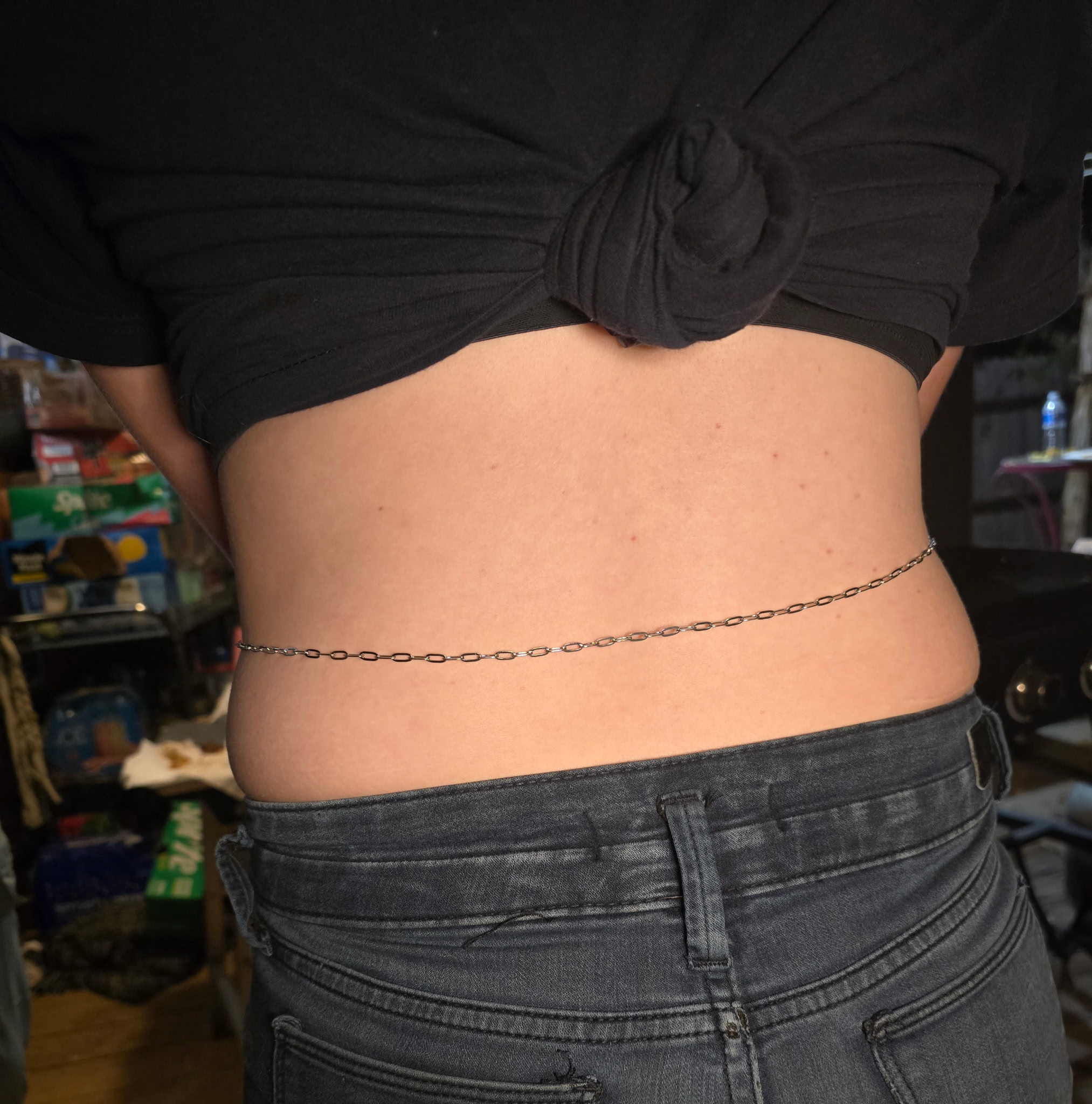 Permanent belly chain worn with dark jeans, clasp-free and custom-fit, Eternally Linked Bling Payson AZ
