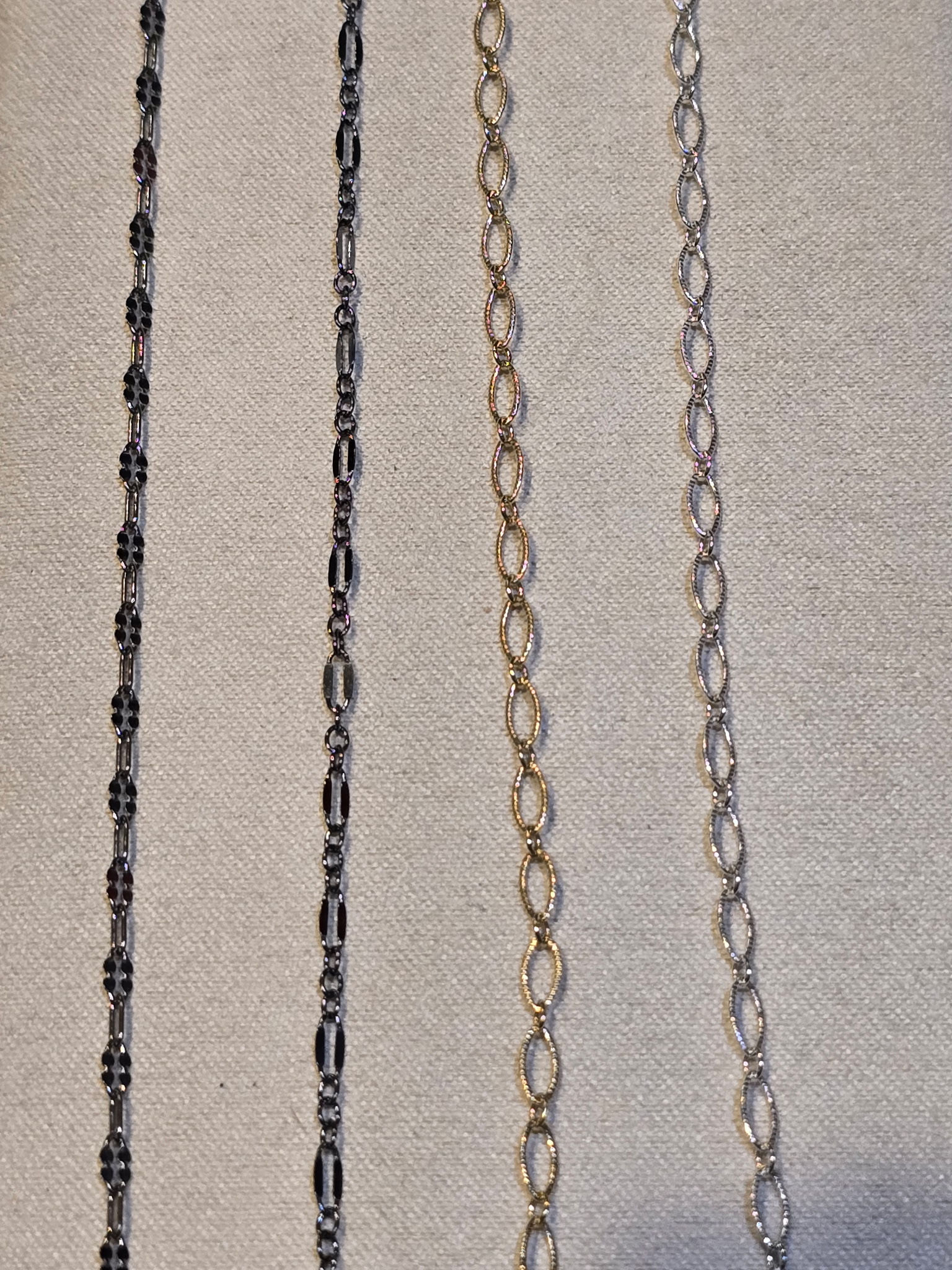 Permanent jewelry chain comparison black enamel silver figaro gold oval link