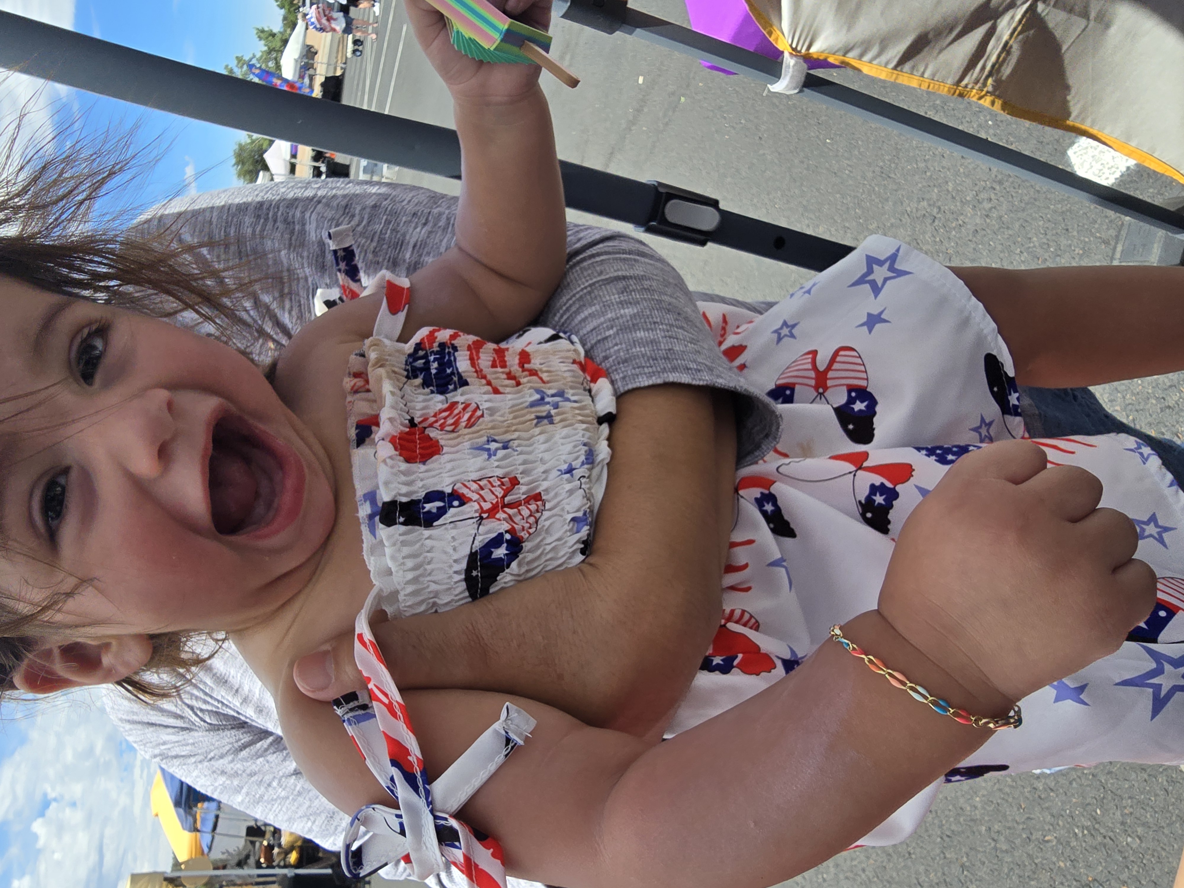 Laughing toddler wearing a tiny kids bracelet at Eternally Linked Bling Payson AZ