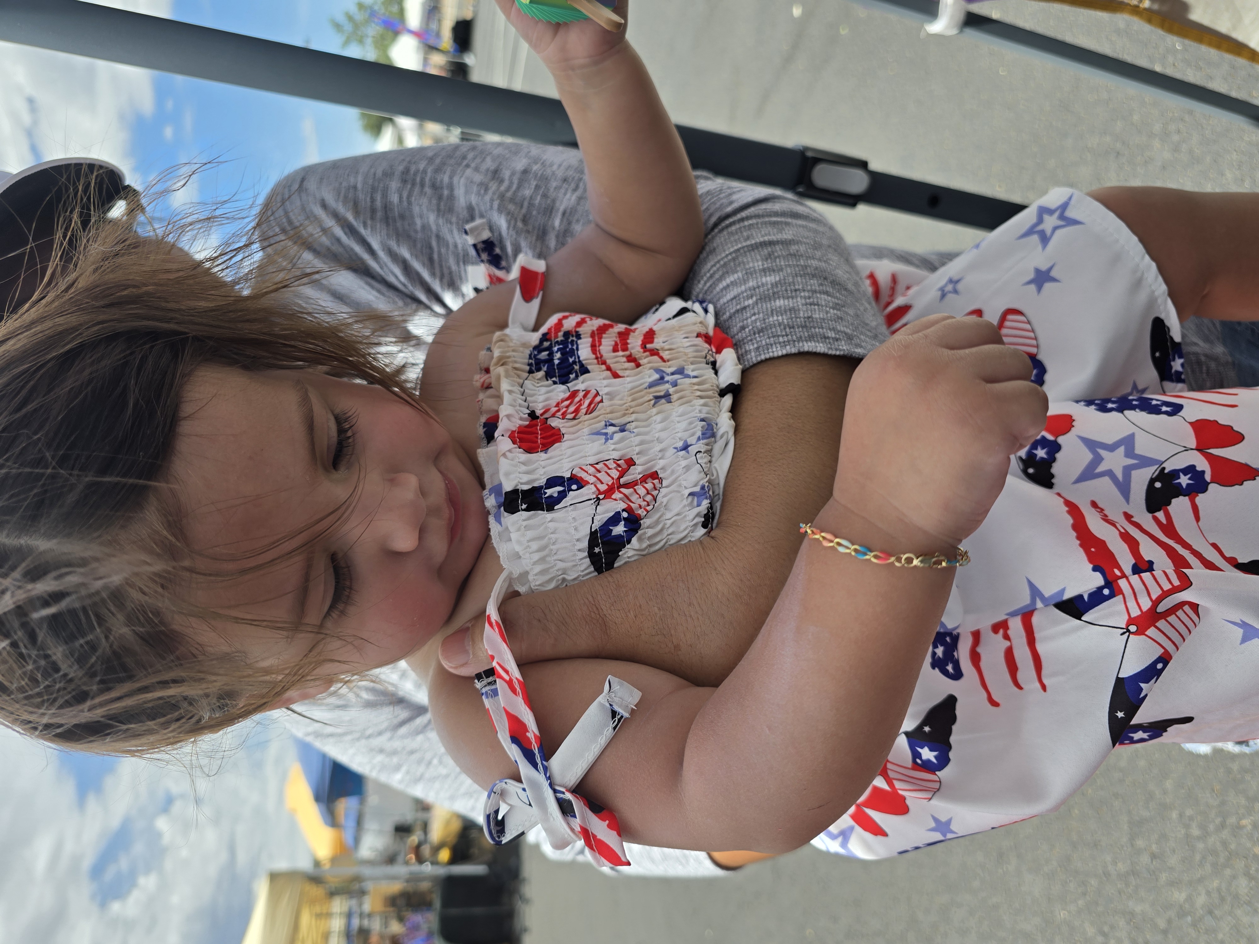 Toddler held up showing off a tiny kids bracelet Payson AZ