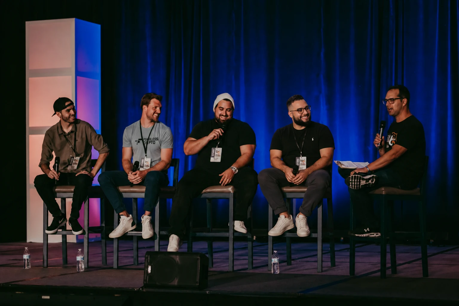 The host speaking on a conference panel