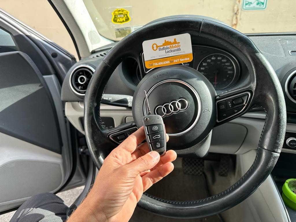 Mobile locksmith picking a car key lock on site in Buffalo