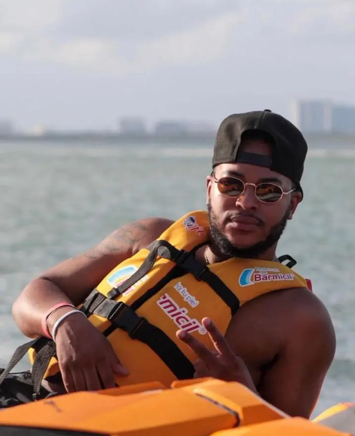 Will on the water wearing a life jacket