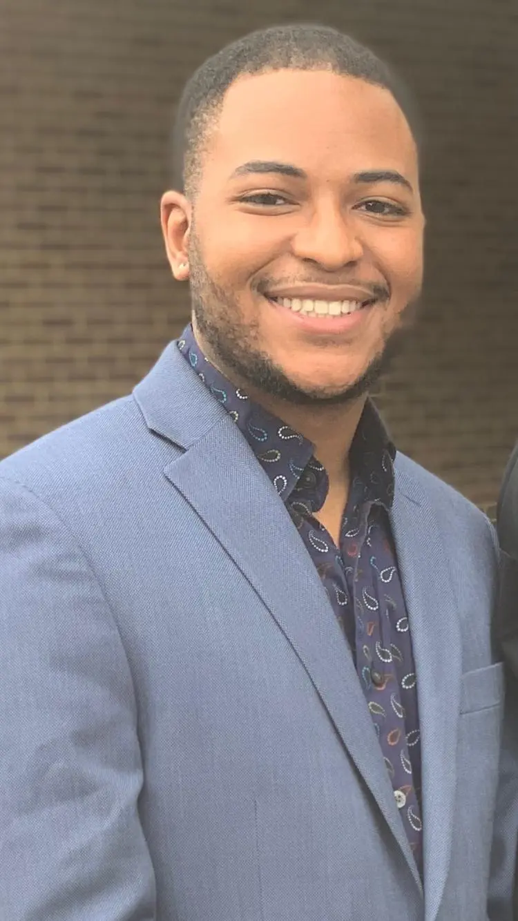 Will smiling in a blue suit