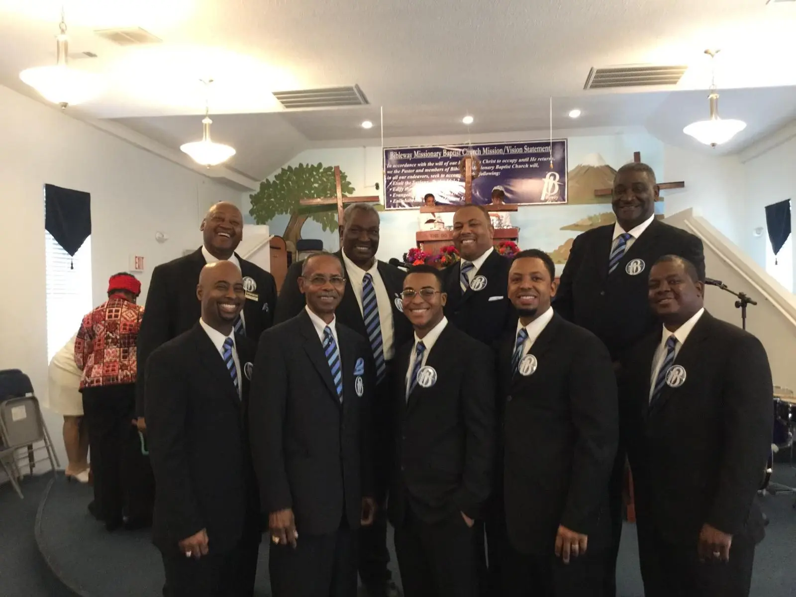 Will with men in suits at a church gathering