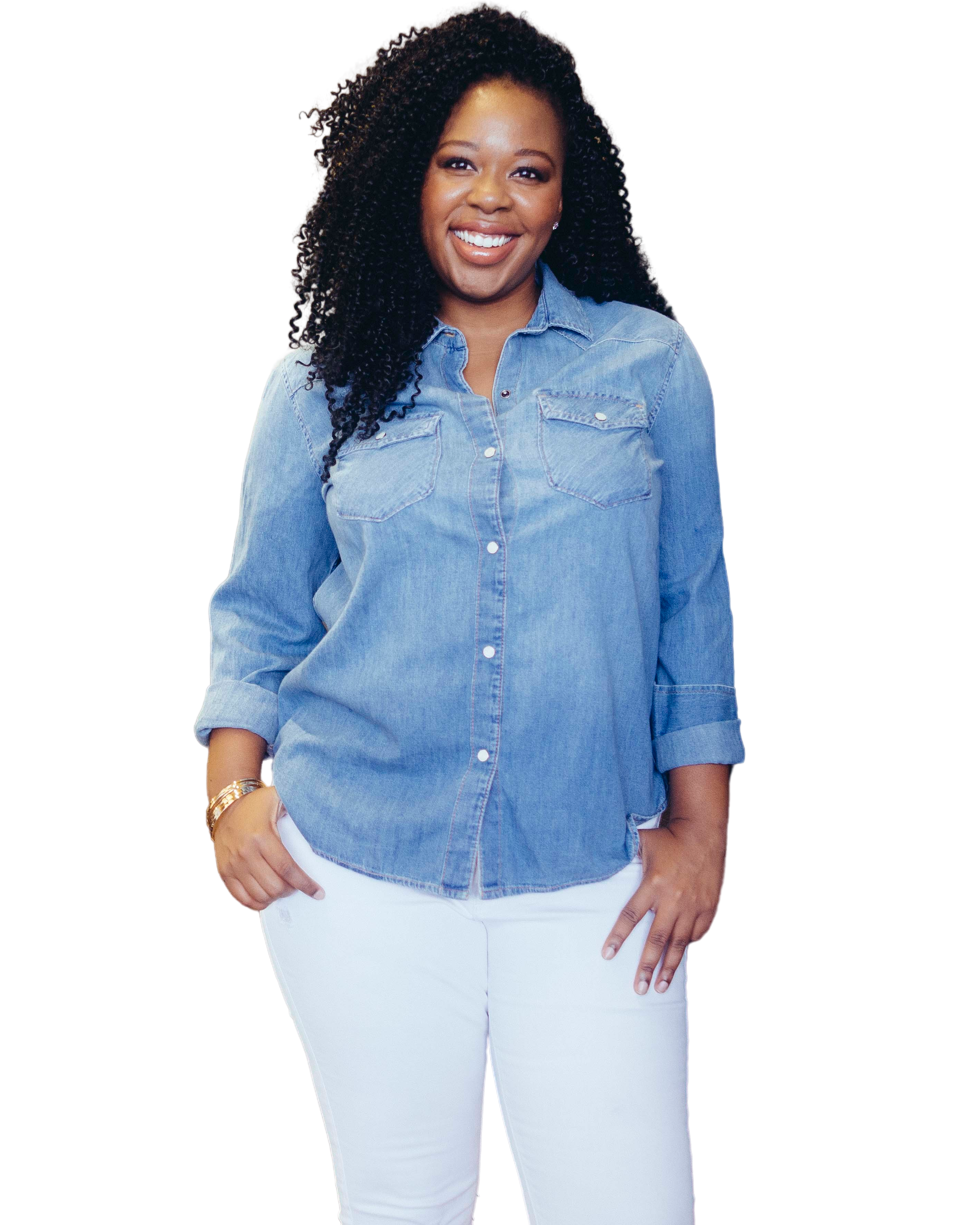 Amanda Spann, smiling, in a denim shirt