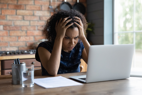 woman staring at computer looking confused woman staring at computer looking confused
