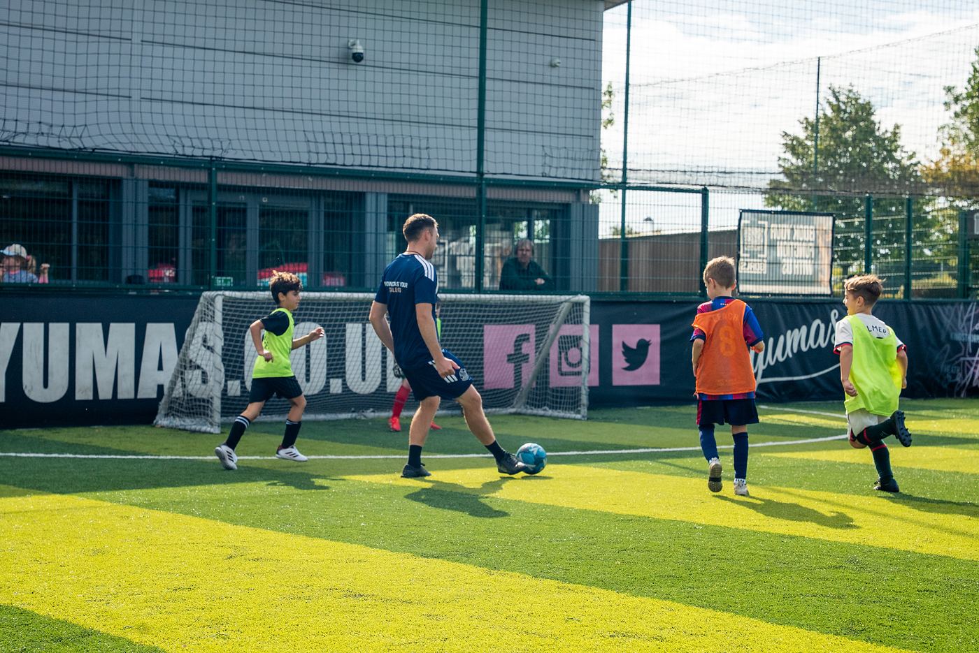 A ShoSoccer coach watching a game