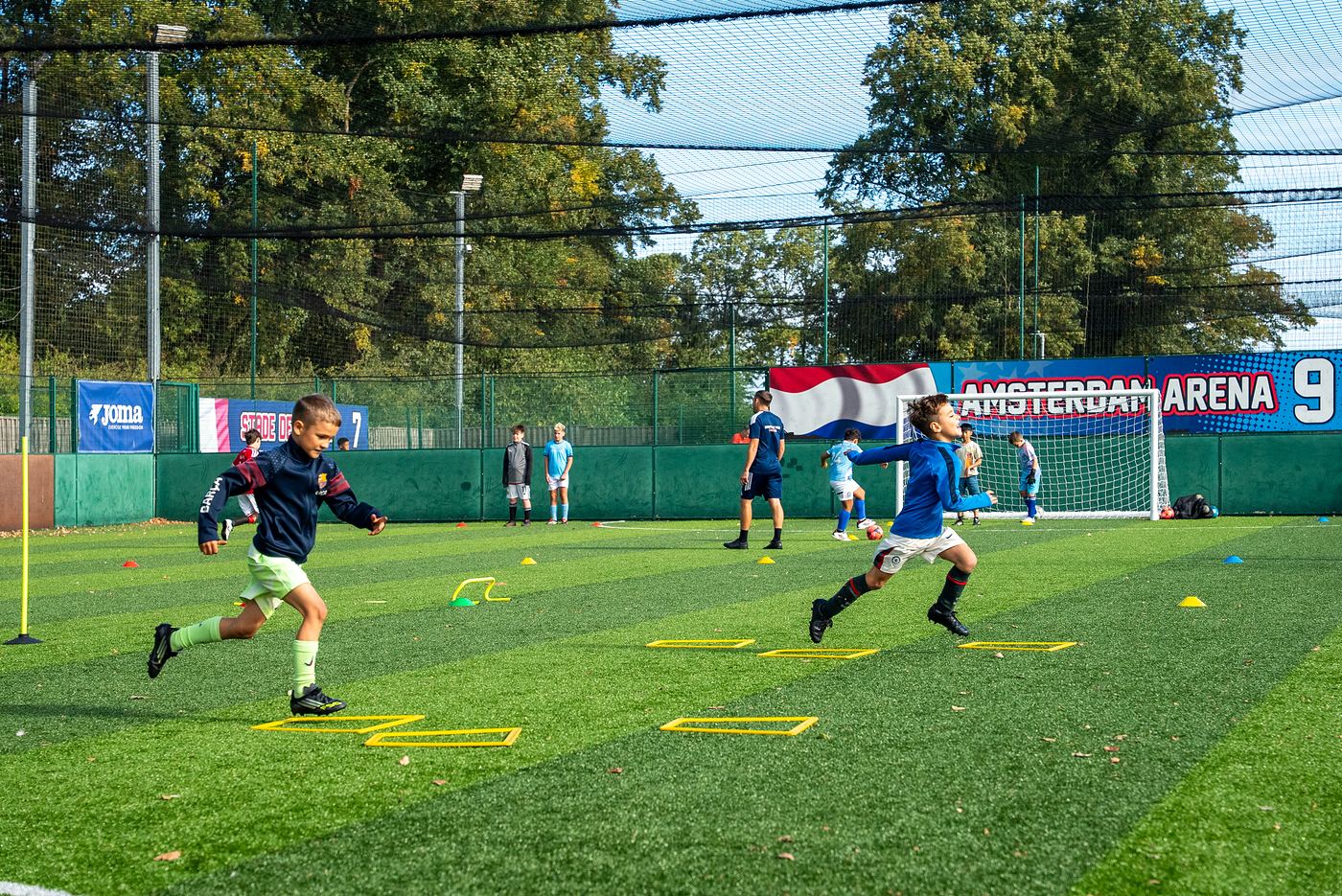 Young players working through a dribbling drill