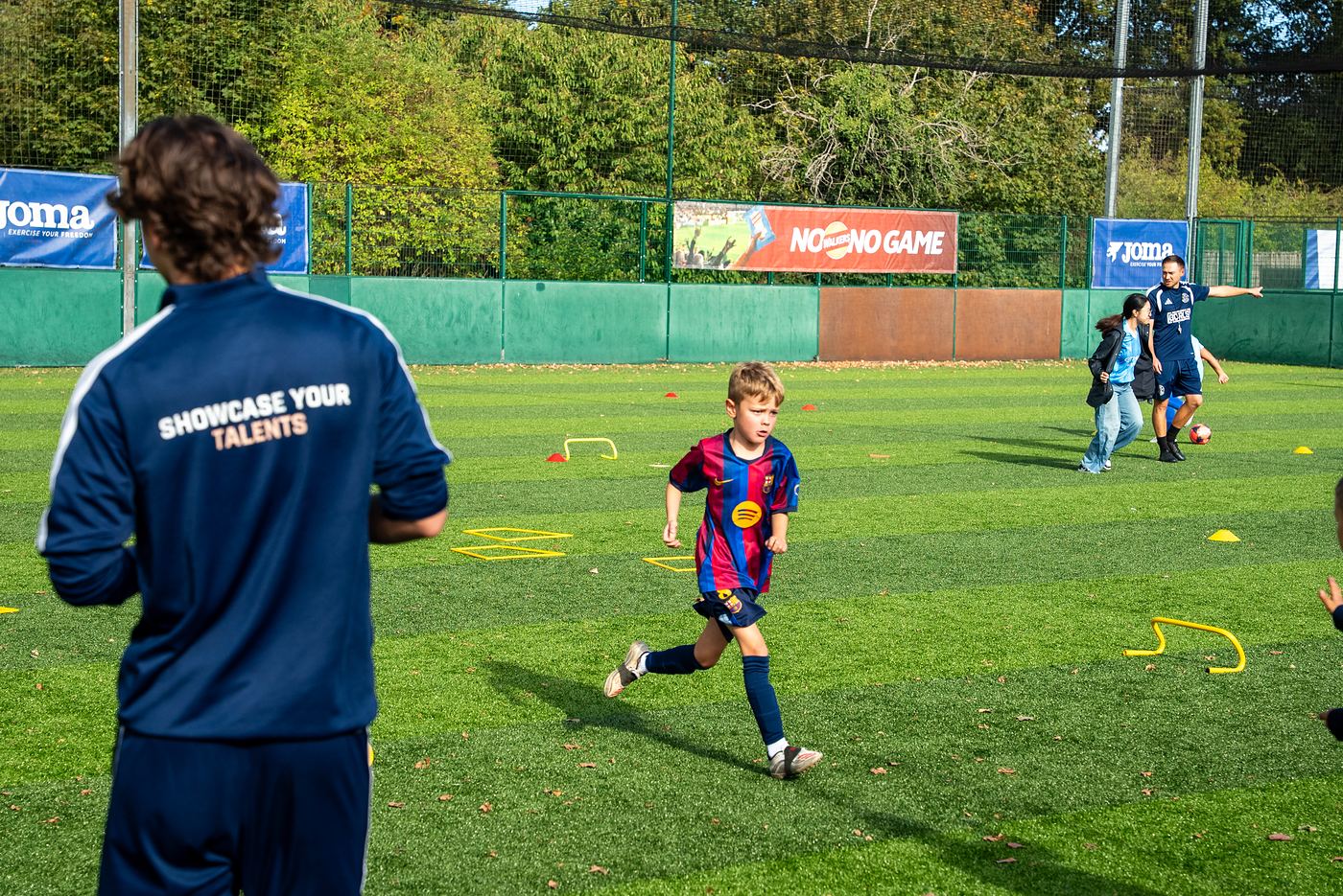 A ShoSoccer coach in the Showcase Your Talents jacket