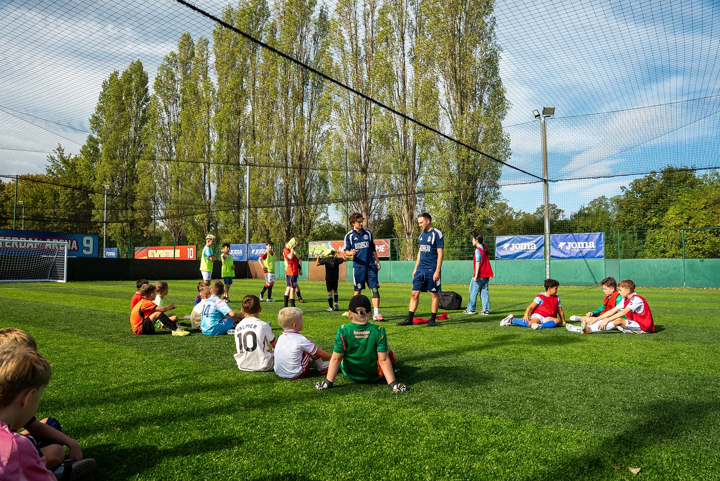 ShoSoccer players listening to their coaches