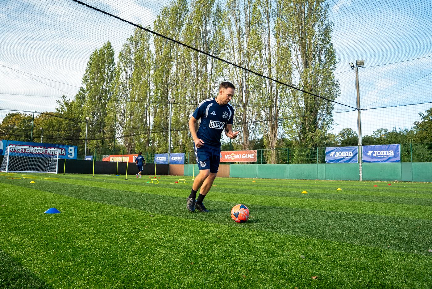 A ShoSoccer coach working one to one with a player