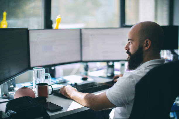 Operator at trading desk reviewing deal flow