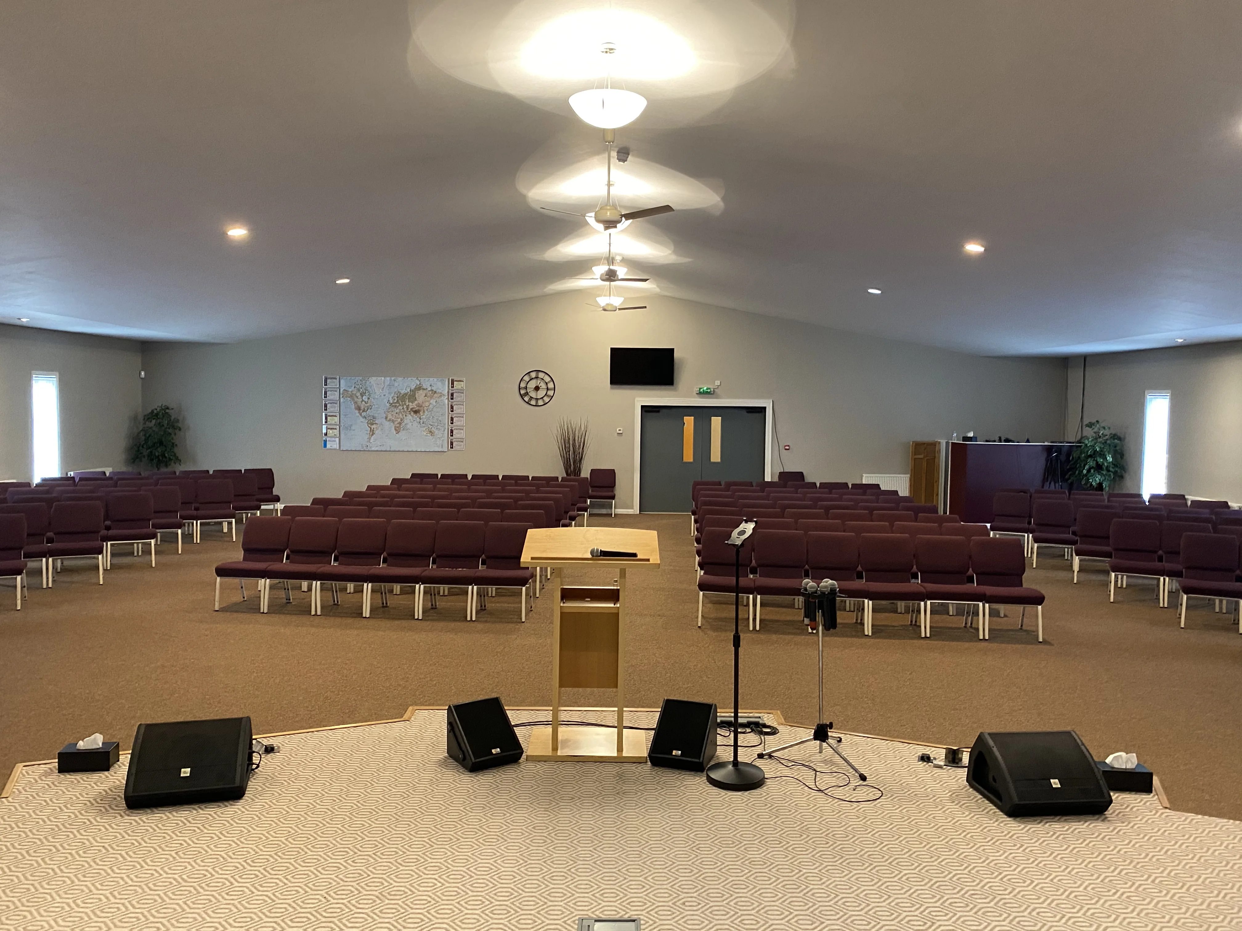 The Auditorium at the Maggie O'Neill Centre from the stage, with the lectern and microphone facing rows of seats