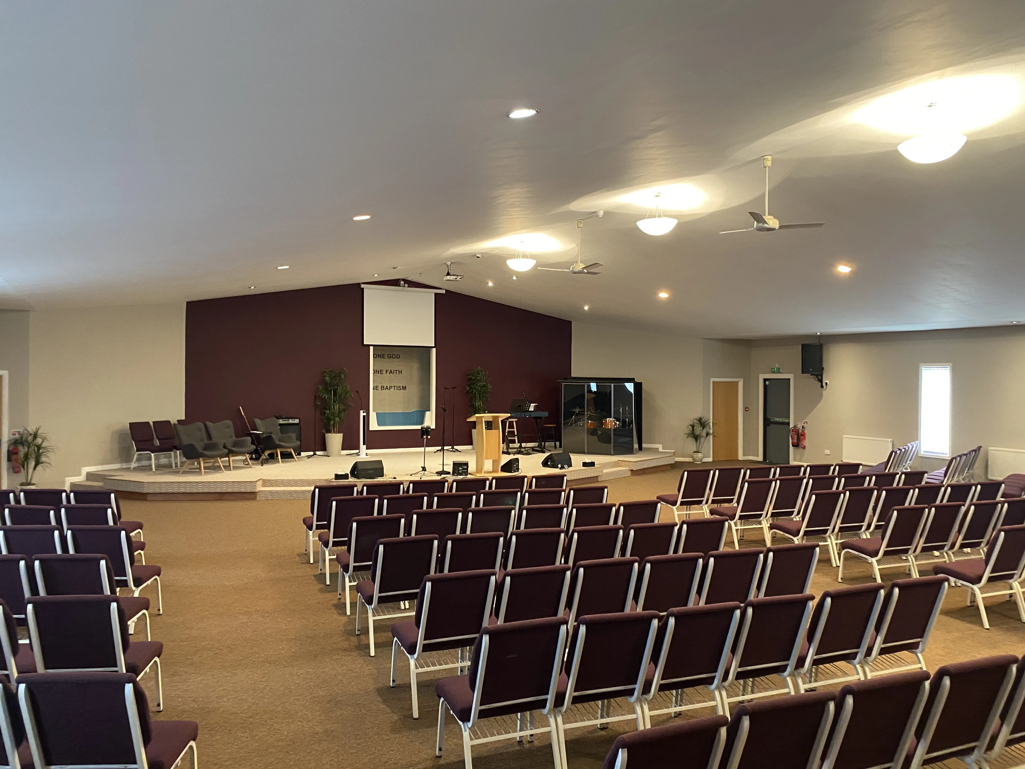 The Auditorium at the Maggie O'Neill Centre from the back, with rows of seats facing the stage