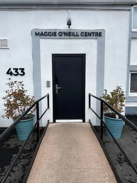 The front door of the Maggie O'Neill Centre at 433 Liverpool Road, with a ramp and handrails