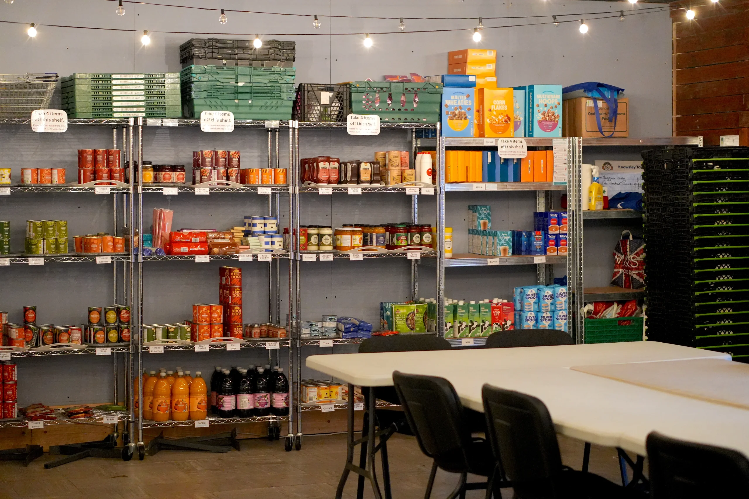The Maggie's Meals pantry shelves at the Maggie O'Neill Centre, stocked with tins, packets and household goods