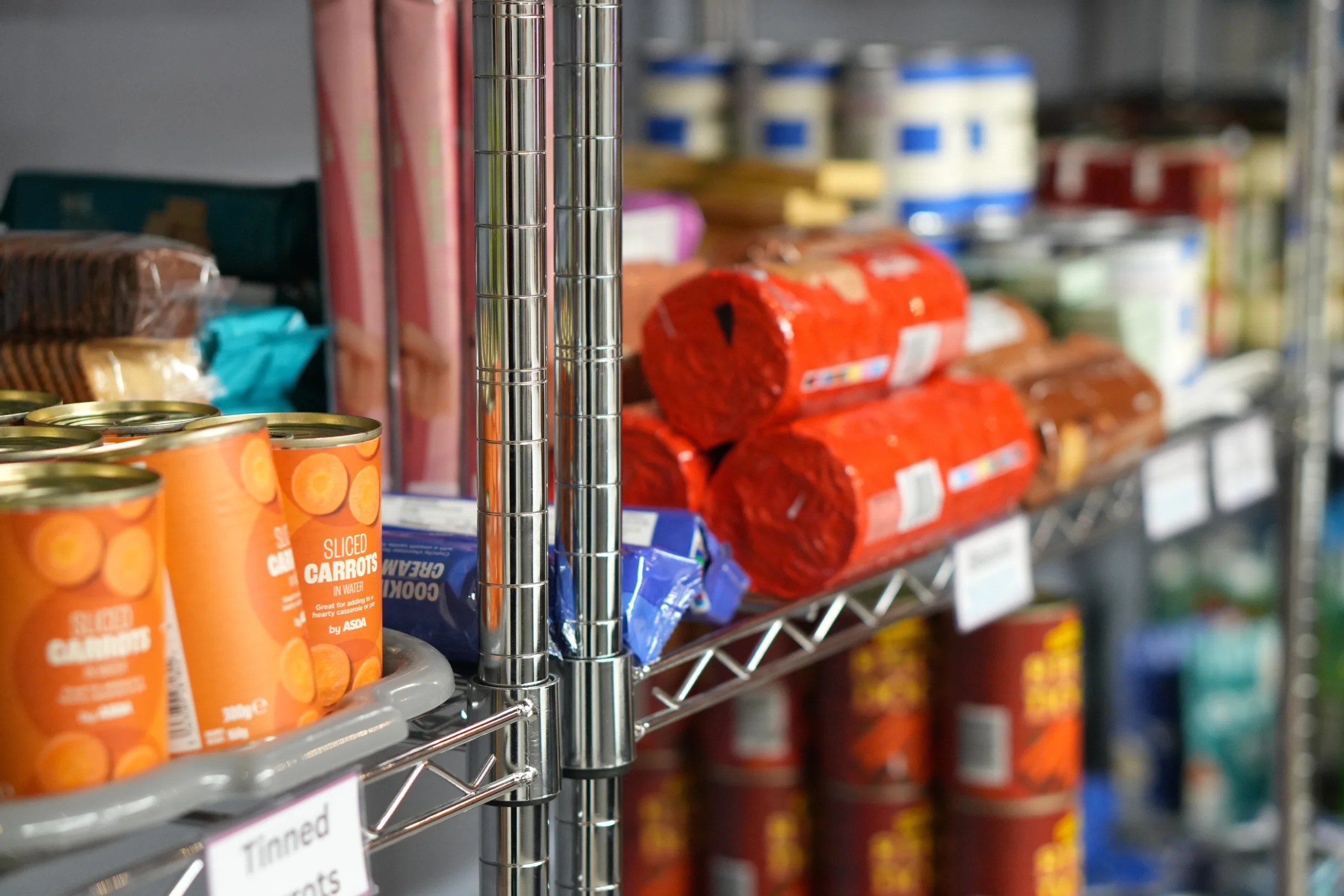 Tins and packets on the Maggie's Meals shelves at the Maggie O'Neill Centre
