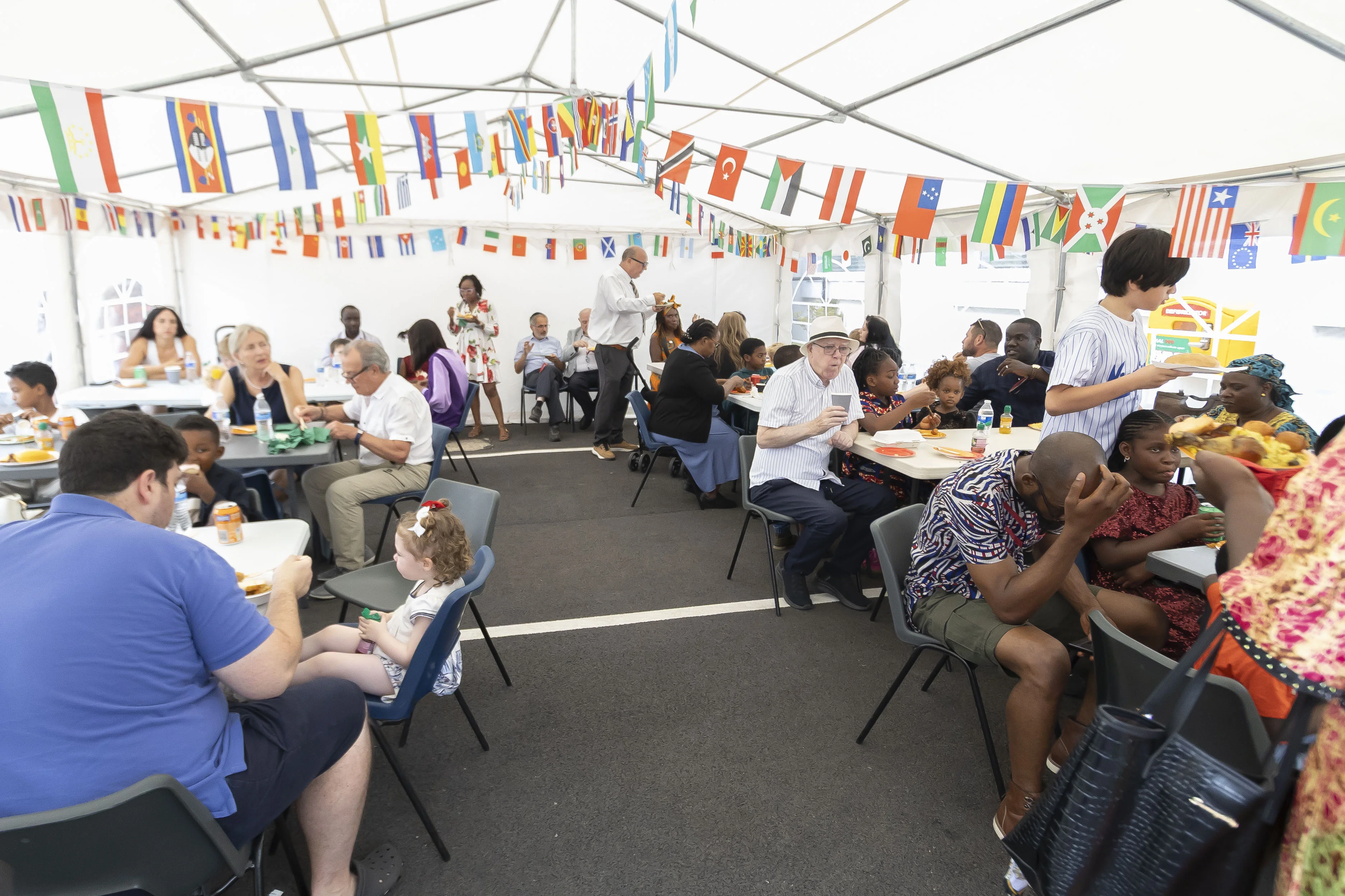 People sharing food and traditional dress at All Nations at the Maggie O'Neill Centre