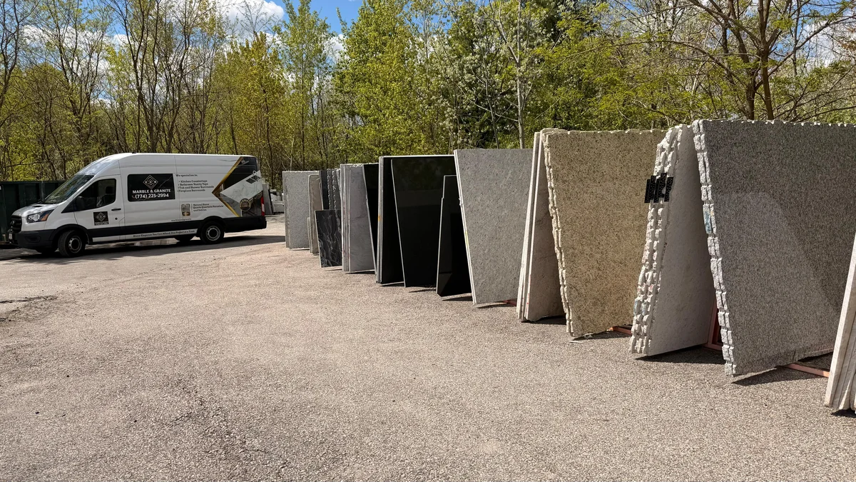 ECR Marble and Granite showroom in Framingham Massachusetts with stone slabs on display