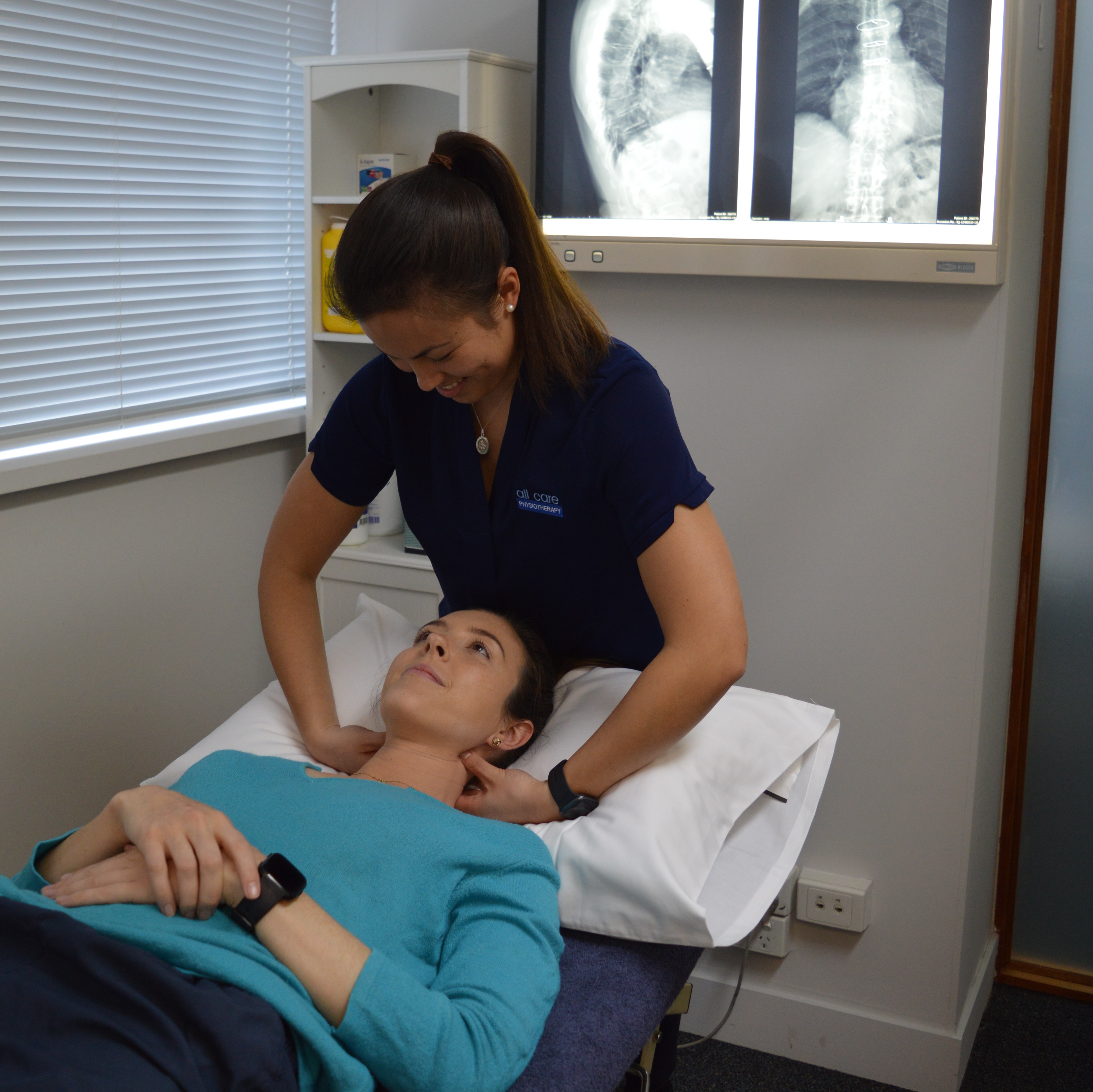 Physio working with client