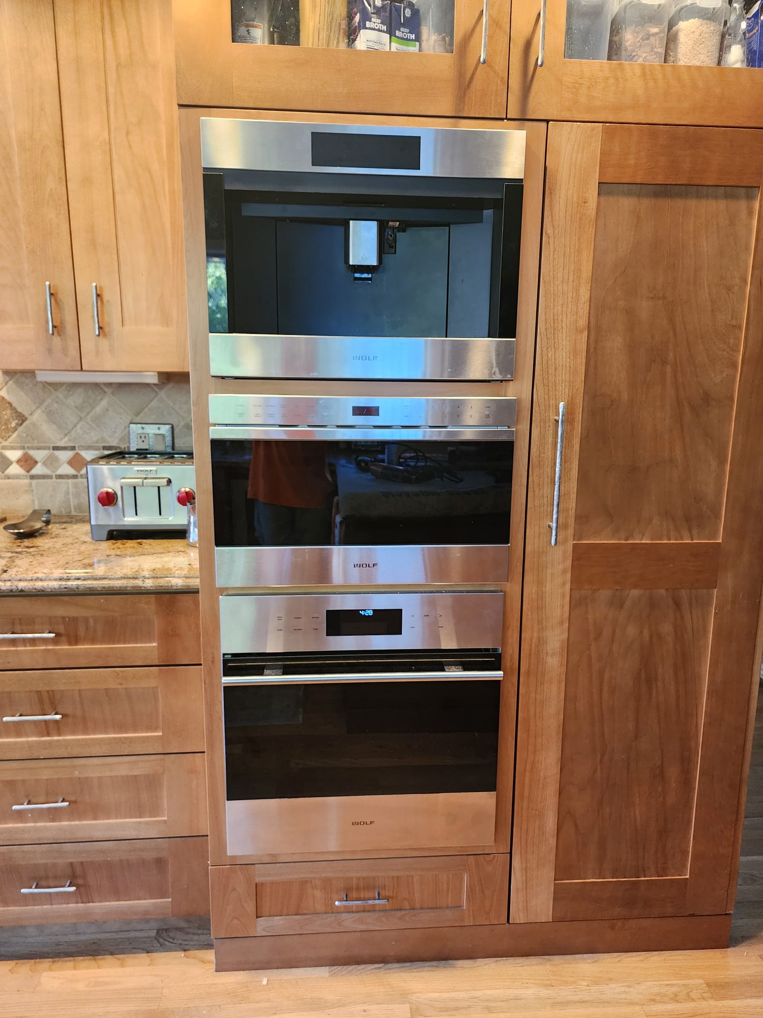 Cabinetry modified around a built-in appliance by SMH Remodeling