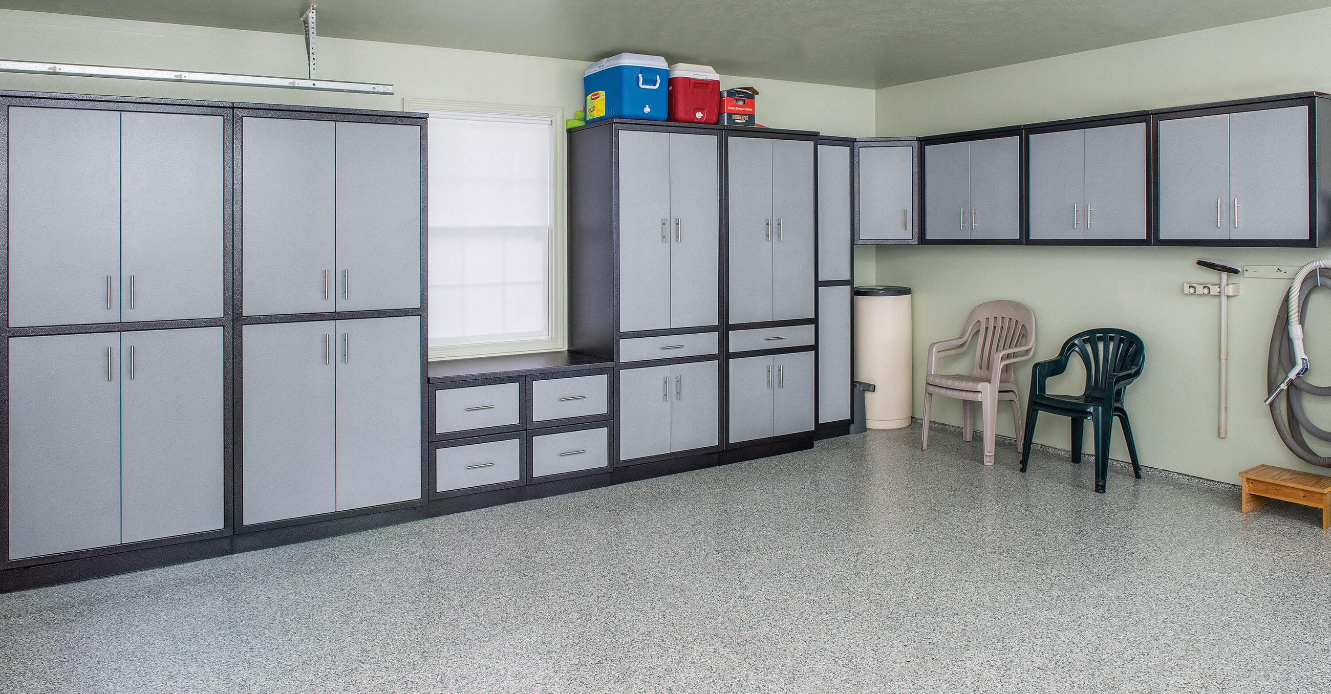 Two-tone aluminum garage cabinets with tall lockers and a drawer bank