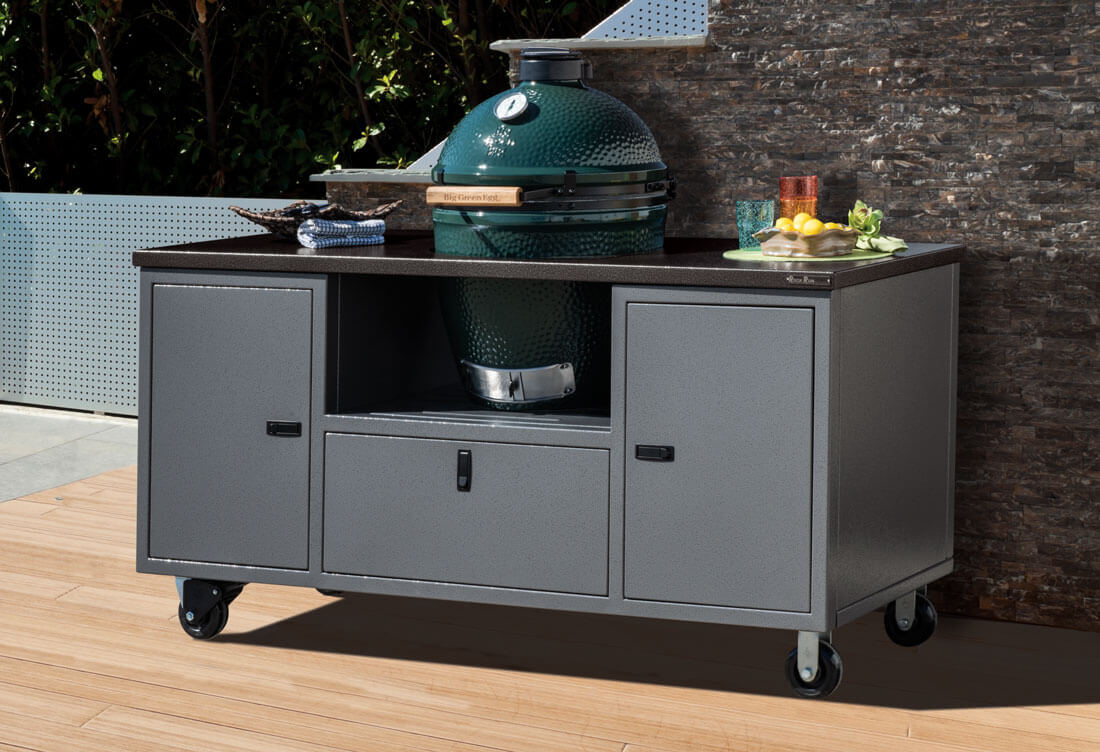 Gray aluminum grill cart with a ceramic grill, locking wheels and storage drawers