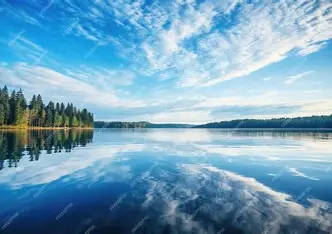 A still lake reflecting the sky, symbolizing clarity and quiet inner awareness.