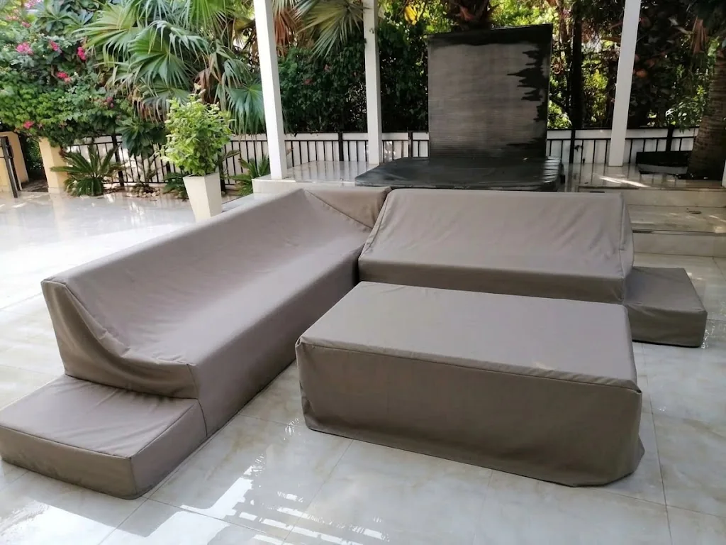 Taupe protective covers on an outdoor sectional sofa