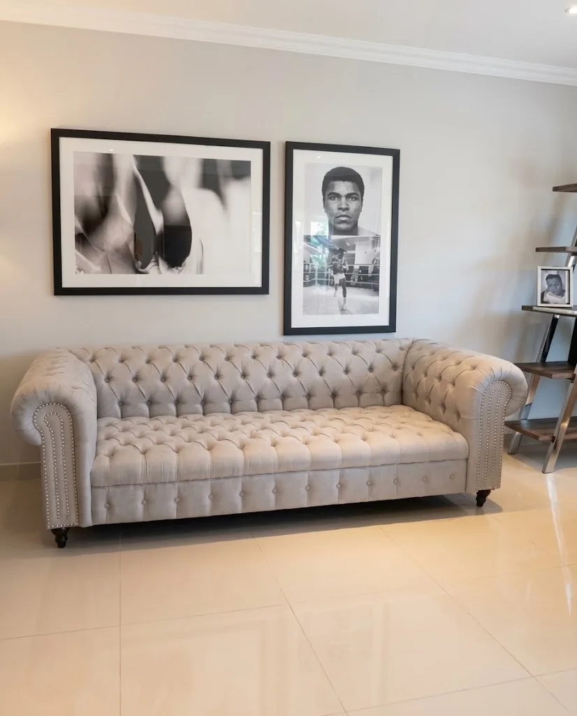 Grey tufted Chesterfield sofa