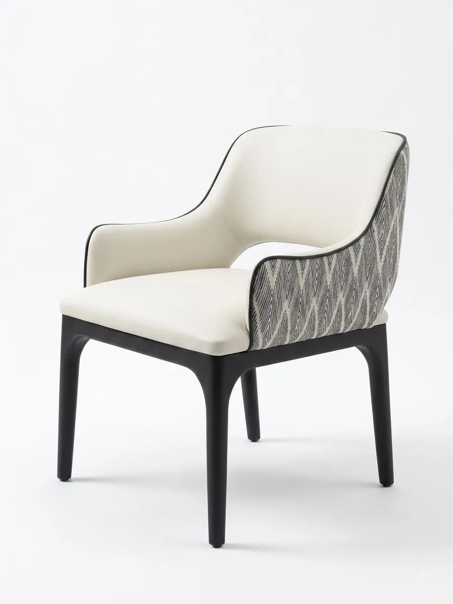 Dining chair with cream upholstery and a patterned grey back
