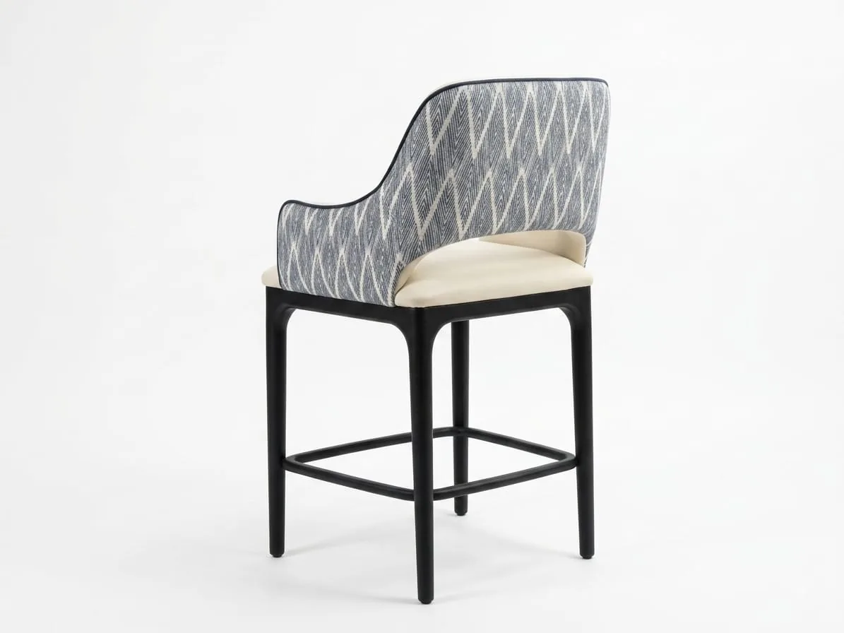 Counter stool with a patterned back and cream seat