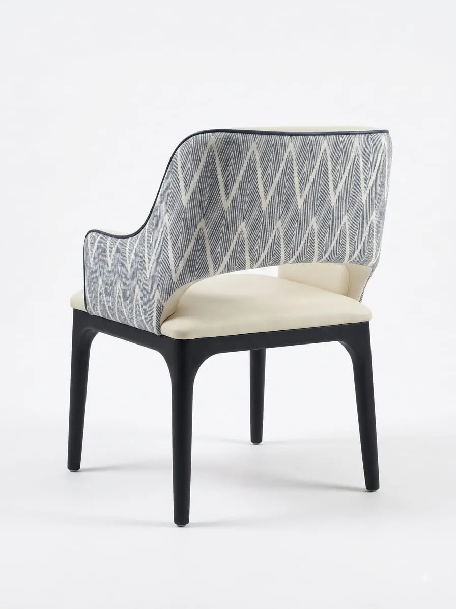 Dining chair with a patterned grey back and cream seat