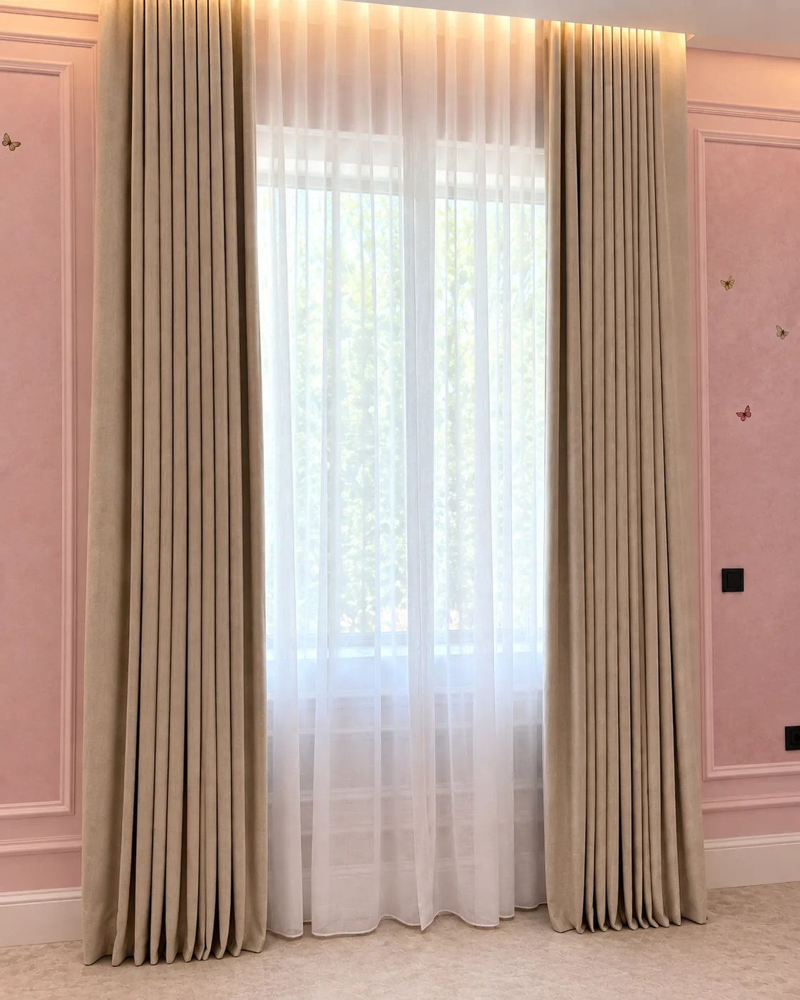 Beige wave curtains and sheers against a pink wall