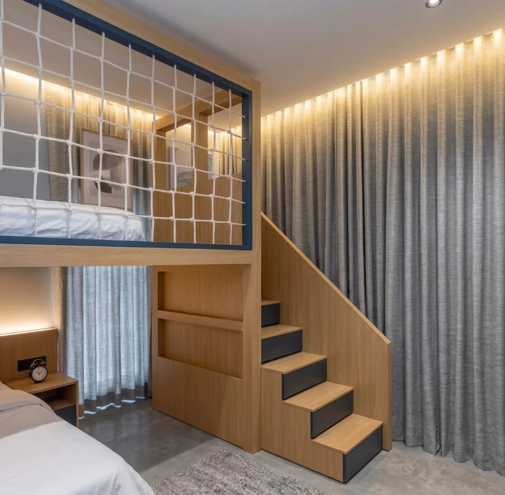 Blue-grey wave curtains in a children's room with a loft bed
