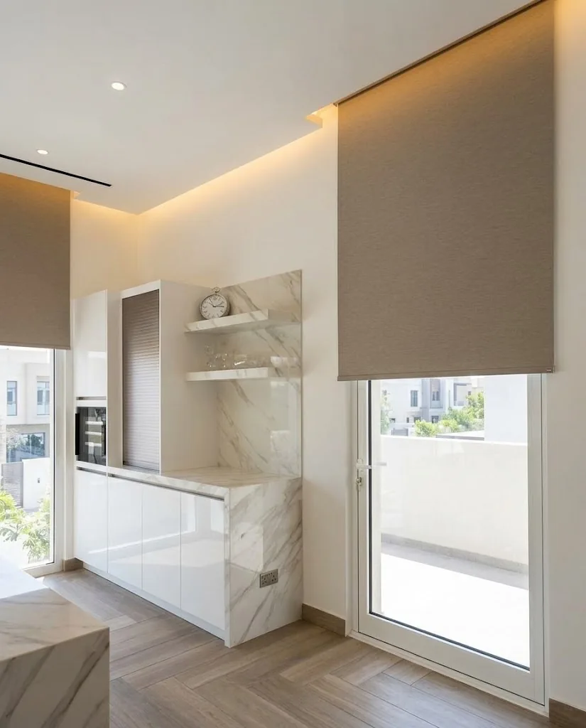 Taupe roller blind on a kitchen balcony door