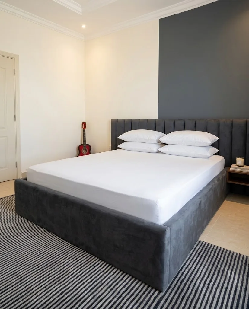 Charcoal channel-stitched headboard and upholstered bed base