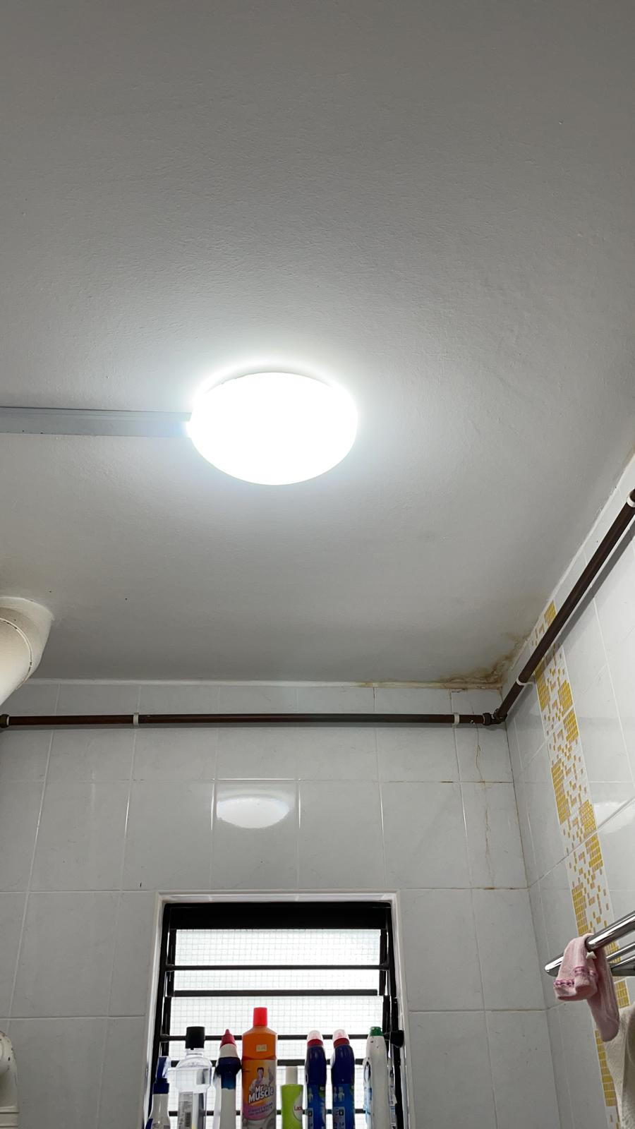 On-site emergency plumber performing urgent pipe leak repair in a Singapore residential property