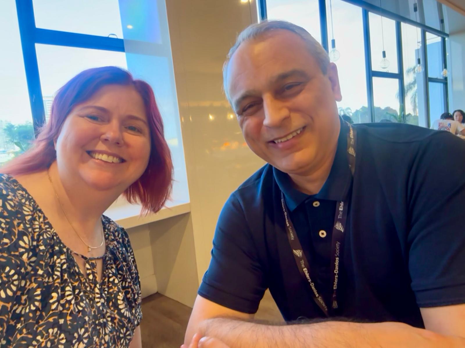 Sharon Hennessey, a white woman with red hair, and Doctor Alan Hakim, a tanned man with grey hair.