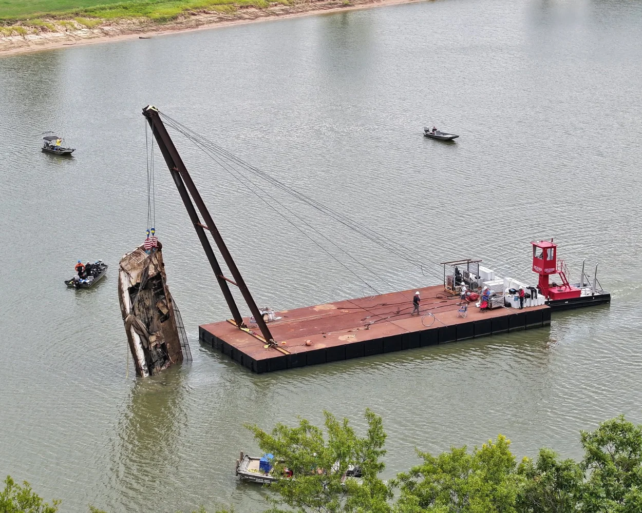 Barge lifting a boat out of the water