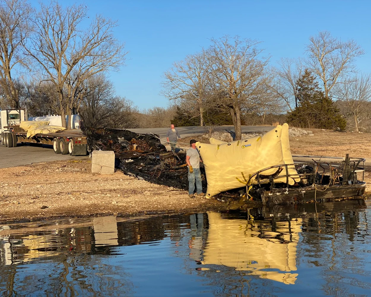 Burnt boat pulled on shore