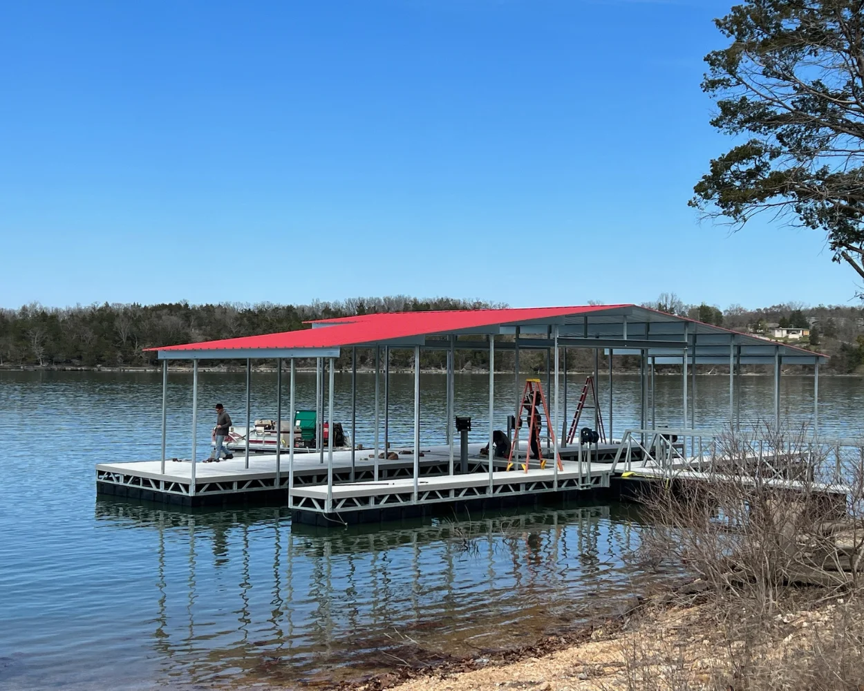 Residential dock with a red roof in Missouri