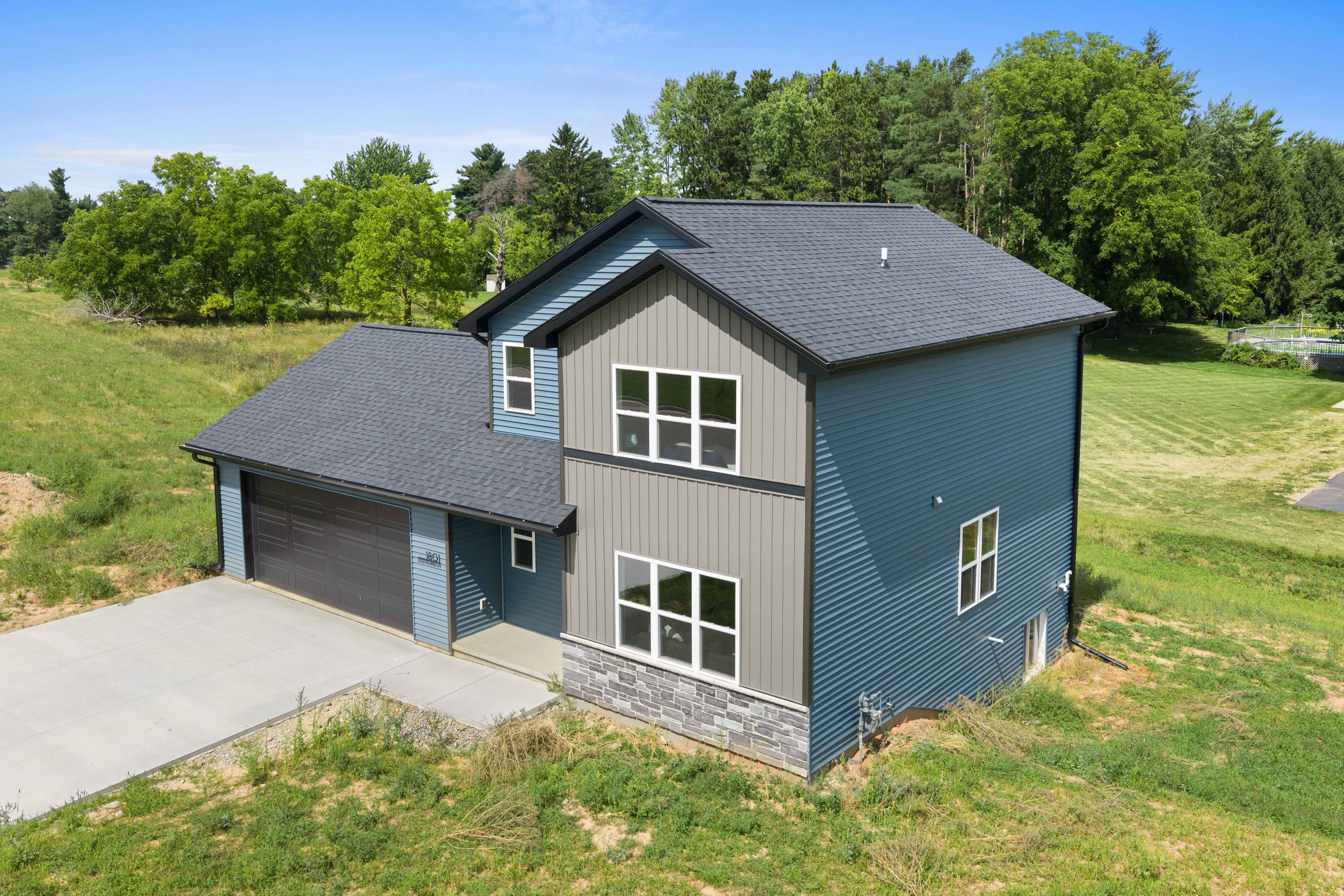Aerial three-quarter view of a finished Celestial Hills home