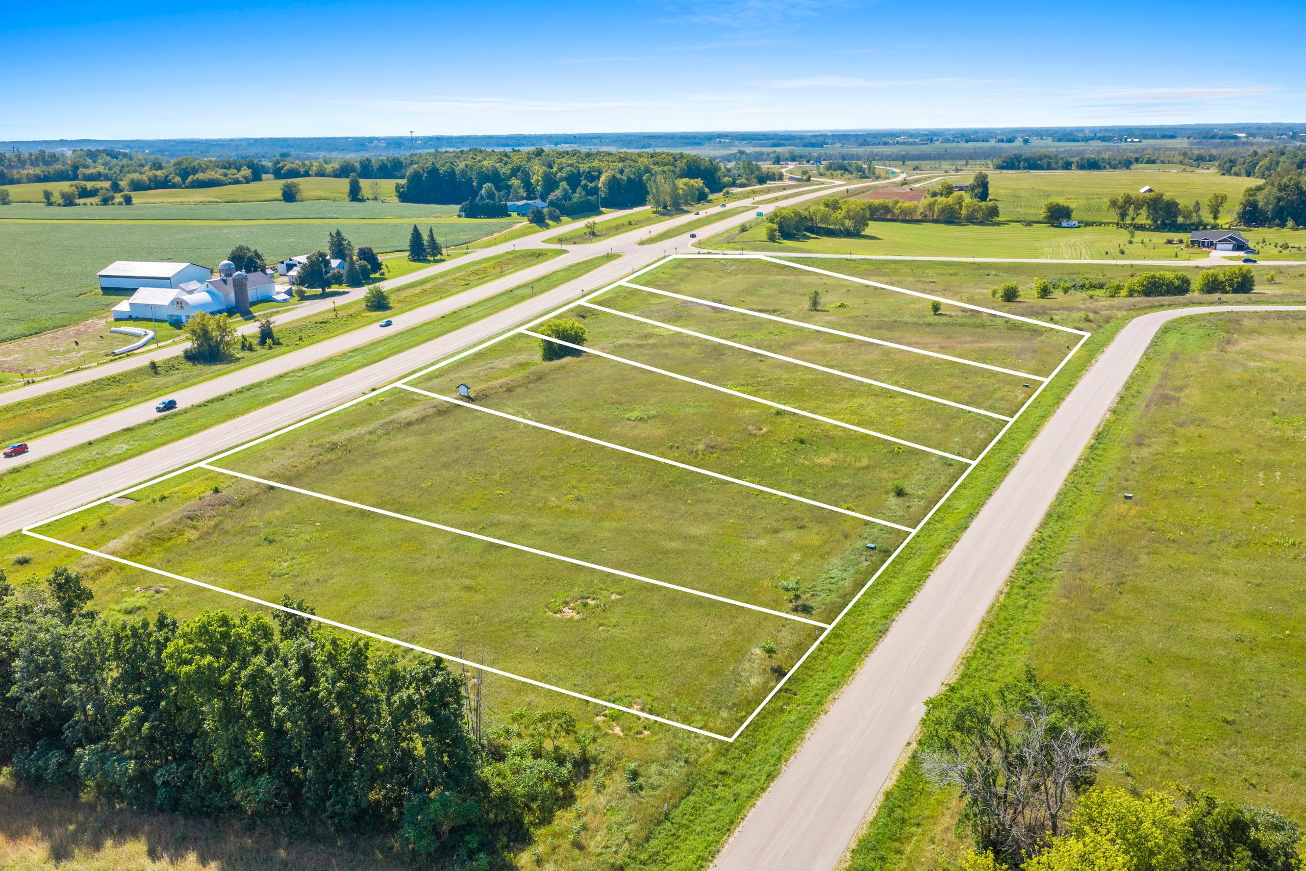 Wide aerial overview of Woodland Hills lots and surrounding landscape